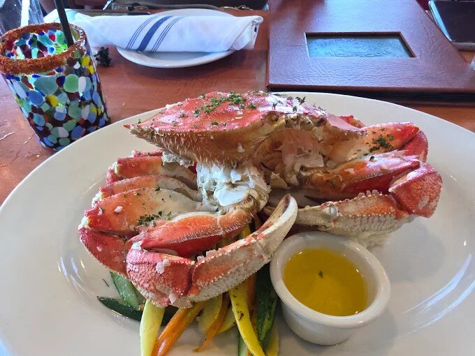 A whole steamed Dungeness crab served with drawn butter